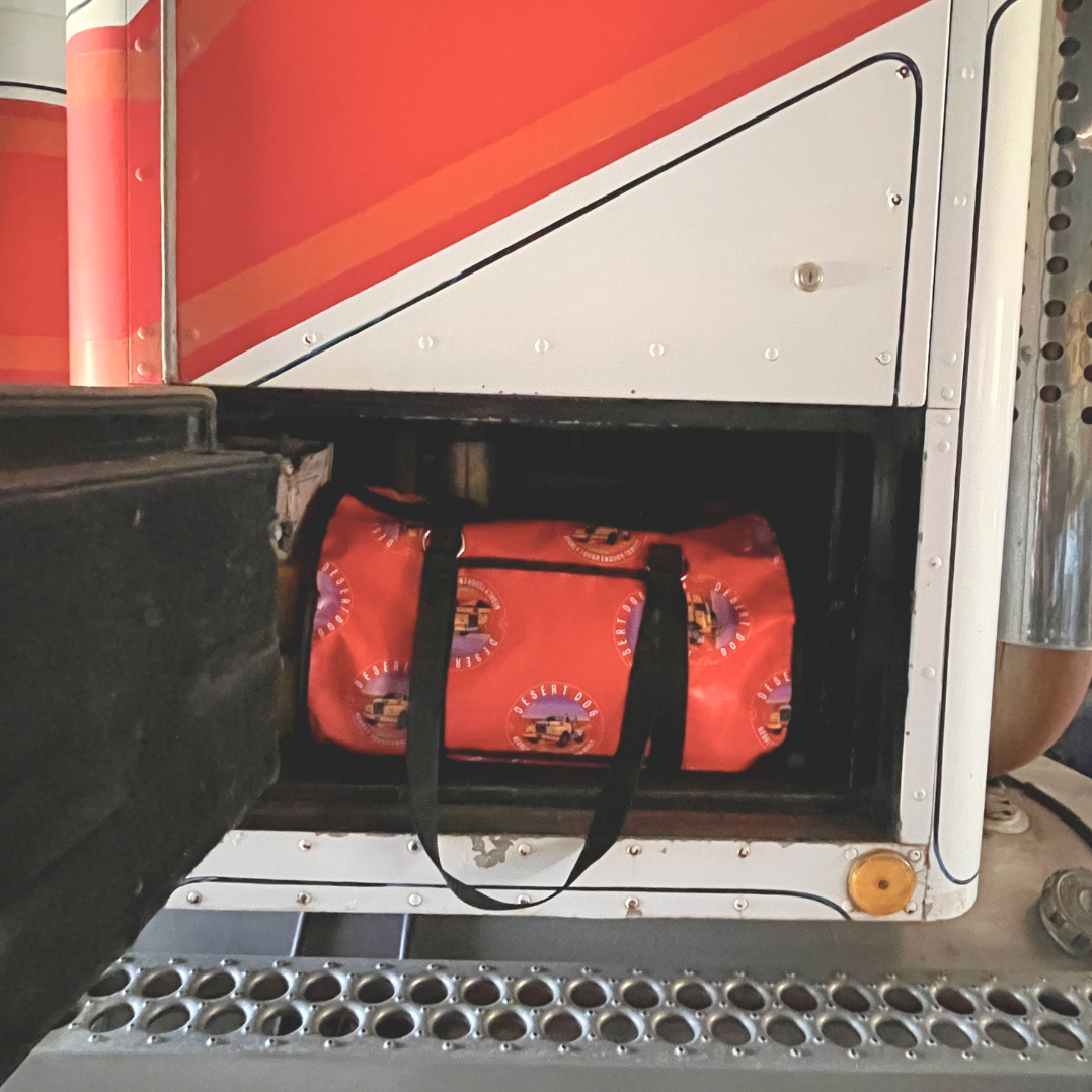 A 25 litre gear bag tucked neatly into the dog box of a Western Star truck.