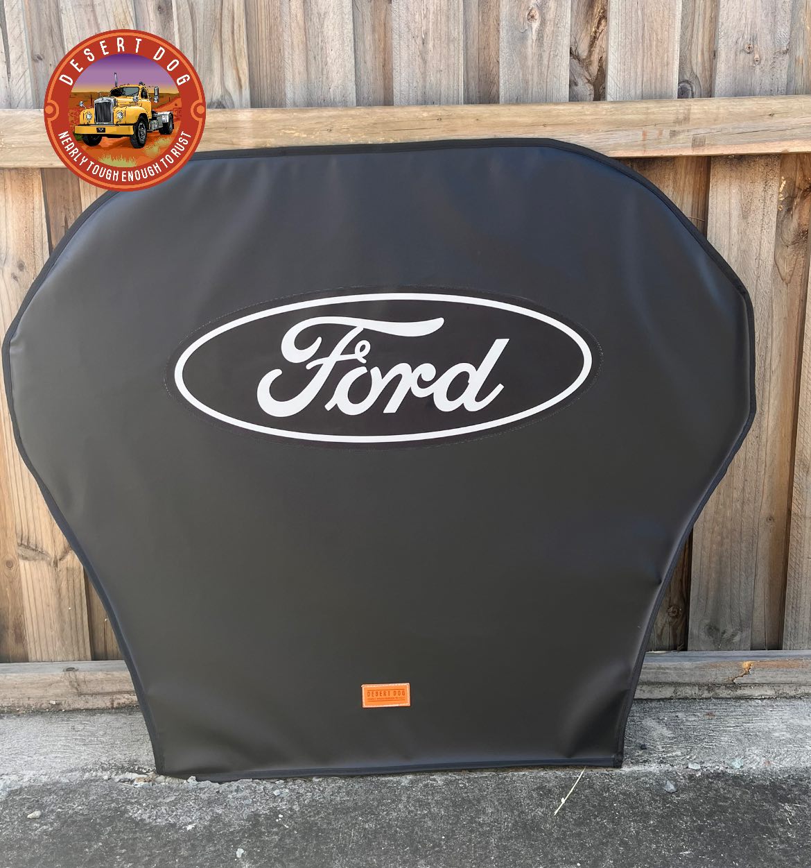 A Desert Dog turntable cover with the Ford truck logo on it.