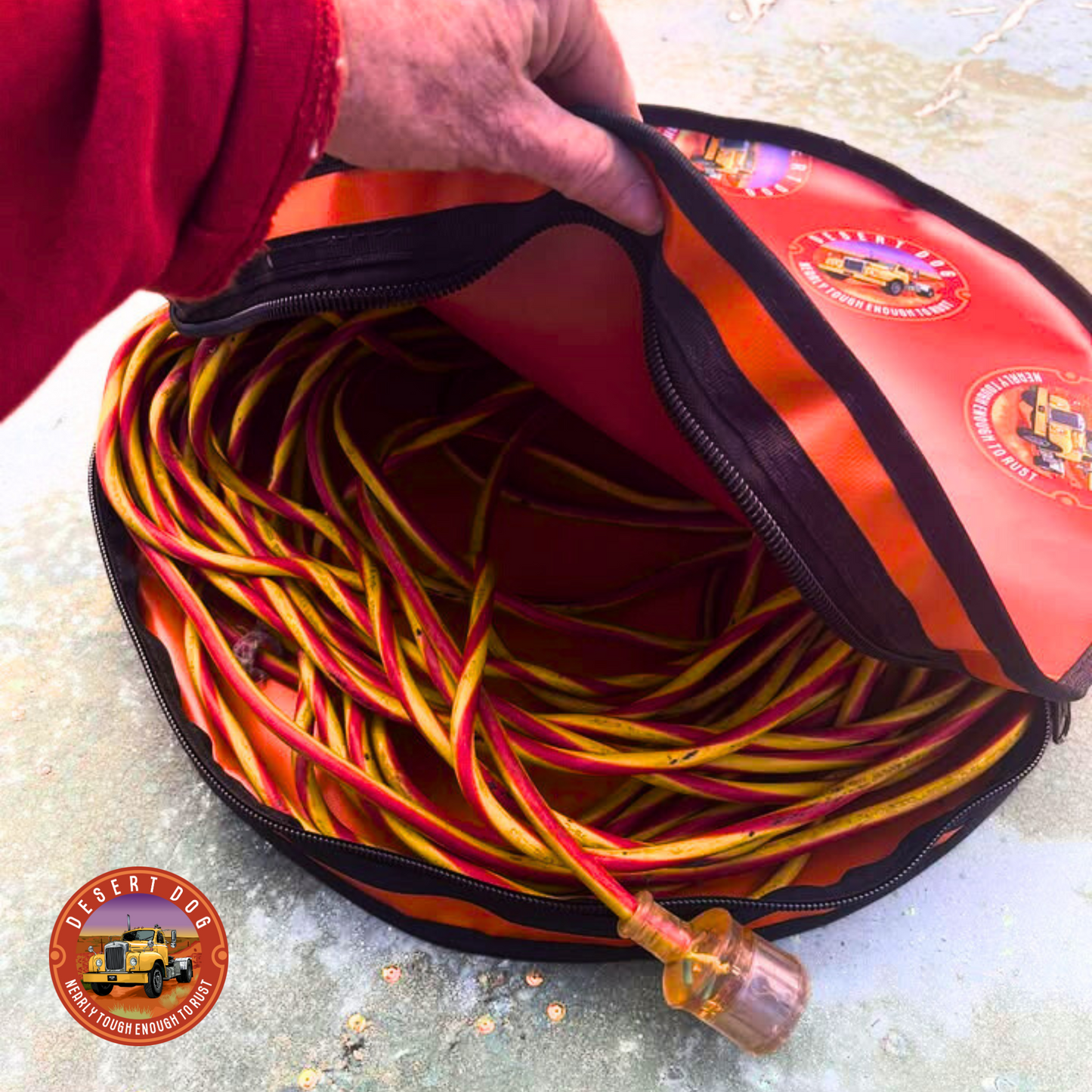 Rust coloured 50cm rope bag with coiled electrical extension lead, featuring Desert Dog logo.