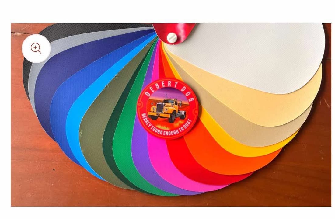 Color swatch chart with a circular design on a wooden surface, showing all 16 colours the Desert Dog rope bags come in
