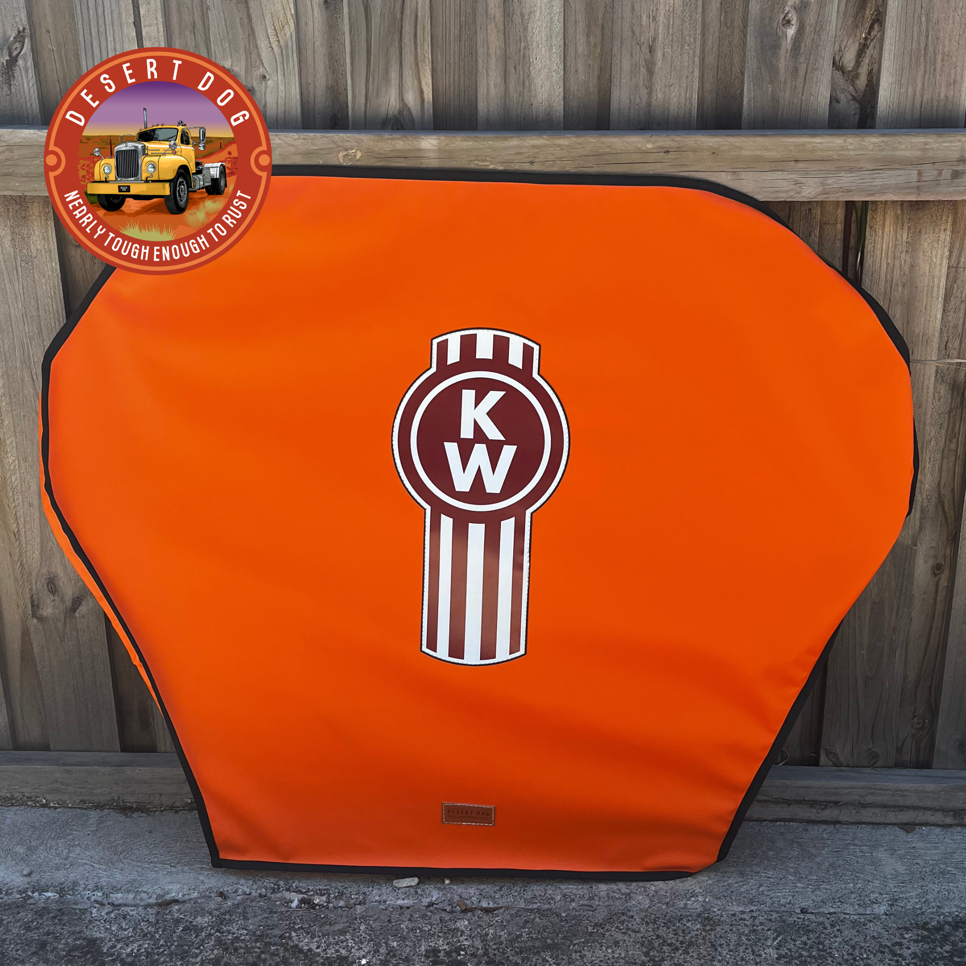 Orange Desert Dog turntable cover with Kenworth Truck logo.