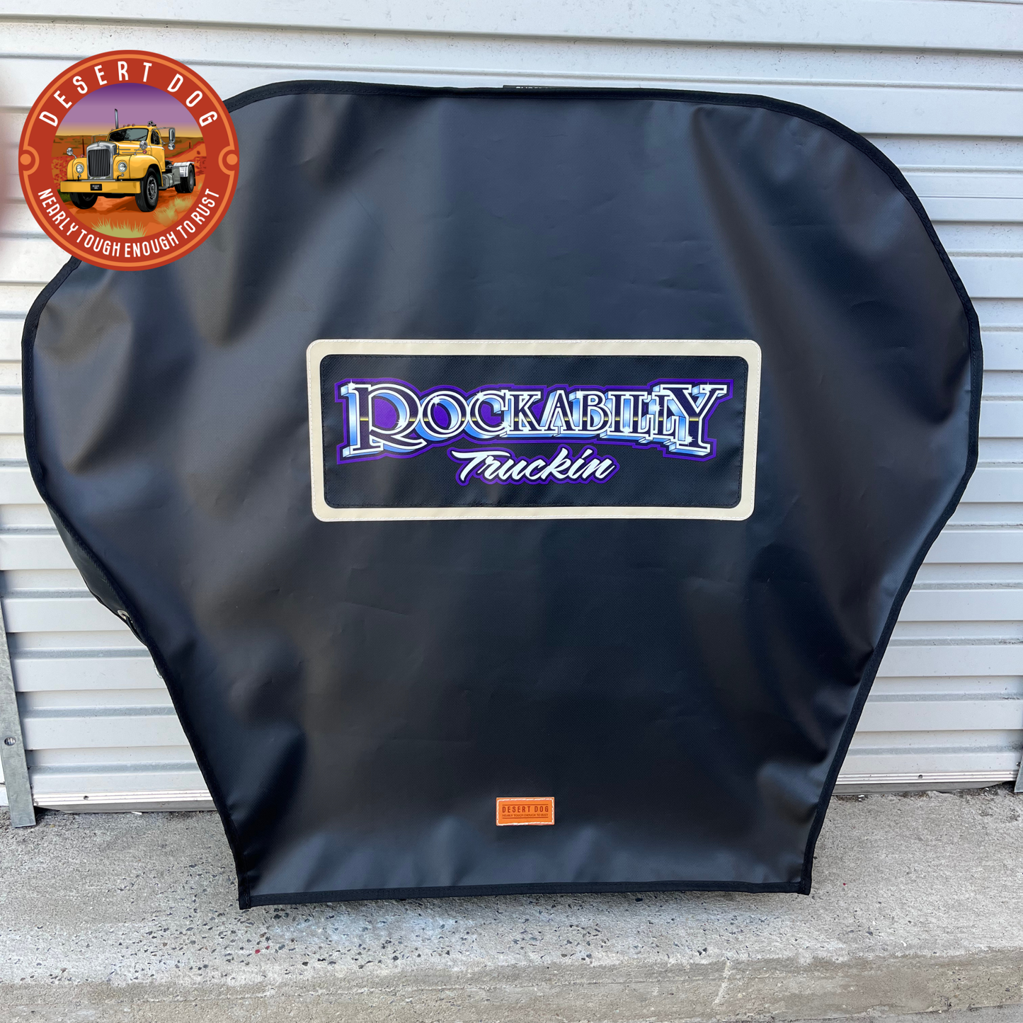 A custom turn table cover with the "Rockabilly Truckin" logo printed onto black vinyl. The logo features purple and chrome detail.