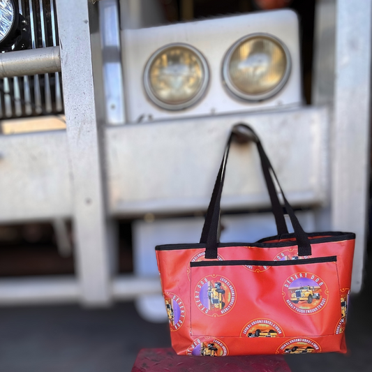 A Desert Dog branded tote bag, hanging from the bullbar of a Western Star prime mover.